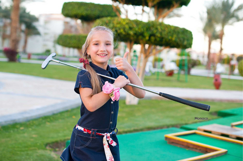 Girl_playing_crazy_golf_on_a_family_activity_holiday